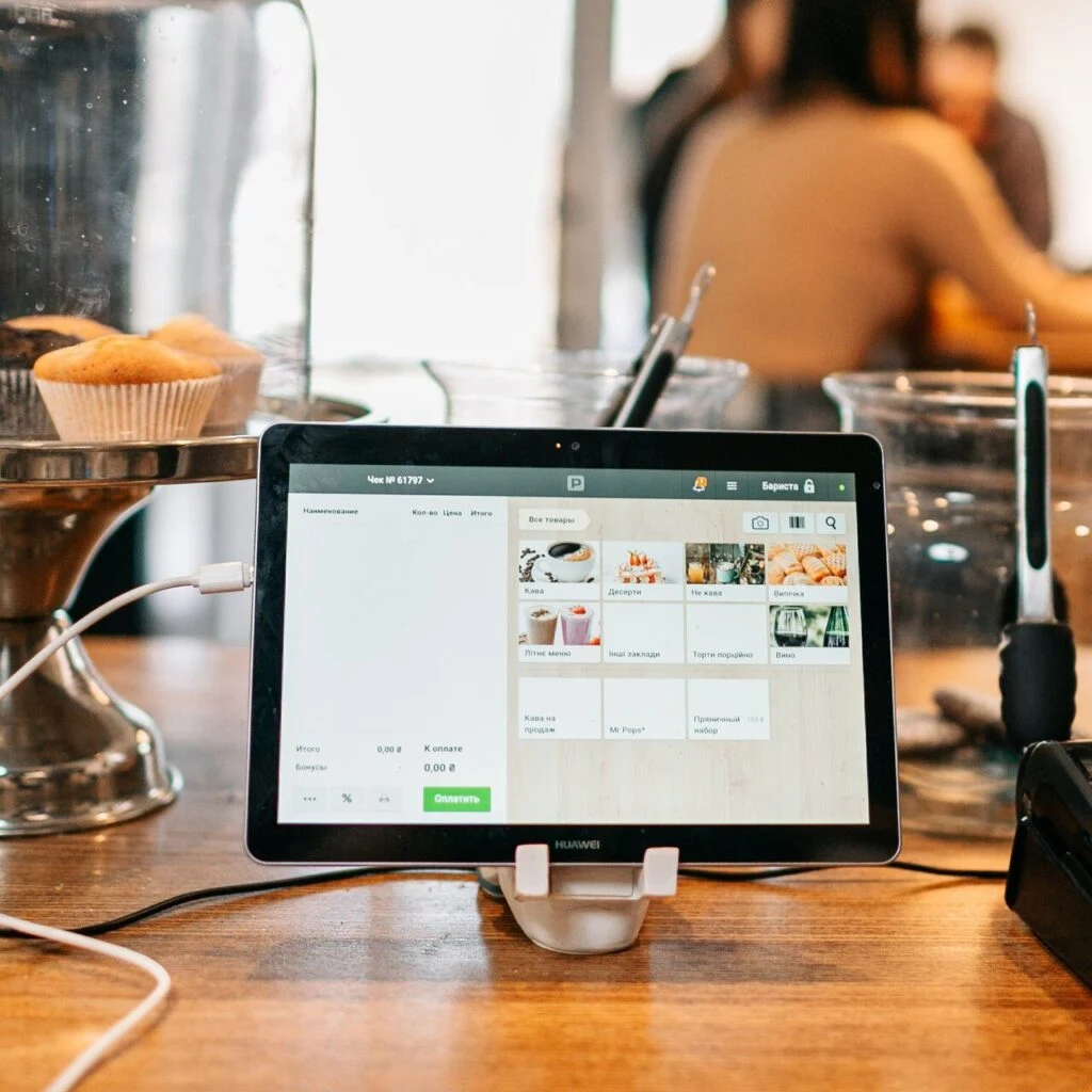 Restaurant table and order management system displayed on a tablet for efficient food service operations